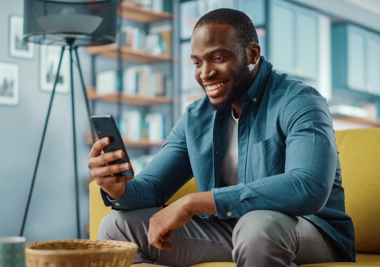 Man smiling at phone